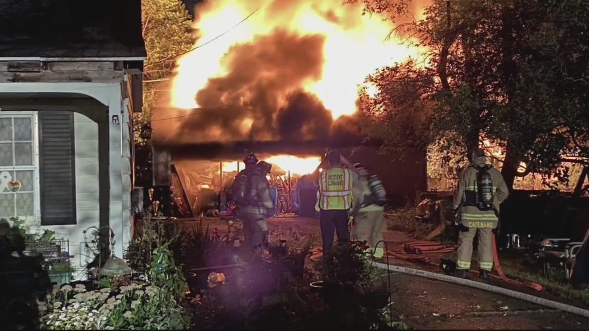 Firefighters, couple watch downed wire burn garage to ground while waiting for DTE